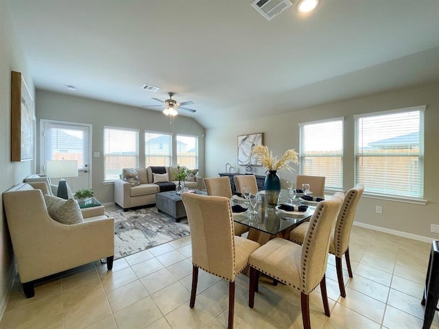 dining area featuring visible vents, a ceiling fan, baseboards, and light tile patterned floors