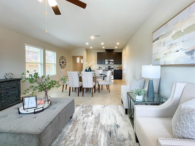 living room featuring visible vents, recessed lighting, baseboards, and ceiling fan