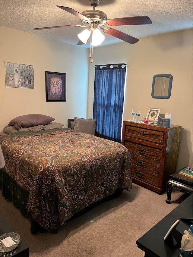 4710 Salina St, Houston, TX 77026 - bedroom featuring carpet, a textured ceiling, and ceiling fan
