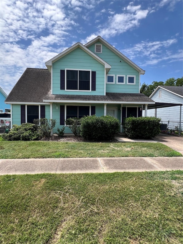 4710 Salina St, Houston, TX 77026 - traditional home with a shingled roof and a front yard