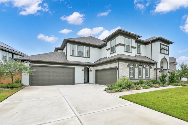27954 Presley Park Dr, Spring, TX 77386 - prairie-style home featuring driveway, a front yard, a garage, stone siding, and stucco siding