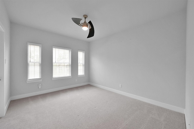 27954 Presley Park Dr, Spring, TX 77386 - unfurnished room featuring baseboards, a ceiling fan, and light carpet