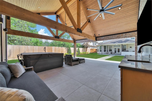 8322 Merlin Dr, Spring Valley Village, TX 77055 - view of patio / terrace with a hot tub, a sink, ceiling fan, and french doors