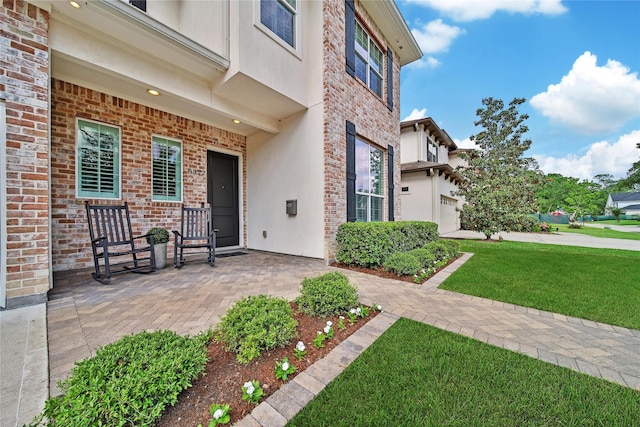 8322 Merlin Dr, Spring Valley Village, TX 77055 - entrance to property with stucco siding, a yard, and a garage