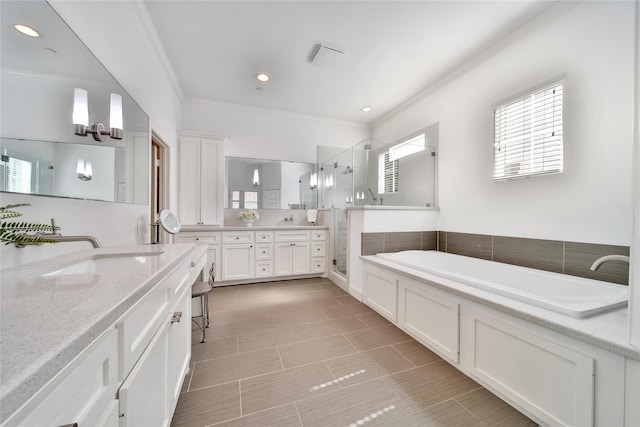 8322 Merlin Dr, Spring Valley Village, TX 77055 - full bath featuring ornamental molding, a shower stall, a bath, vanity, and recessed lighting