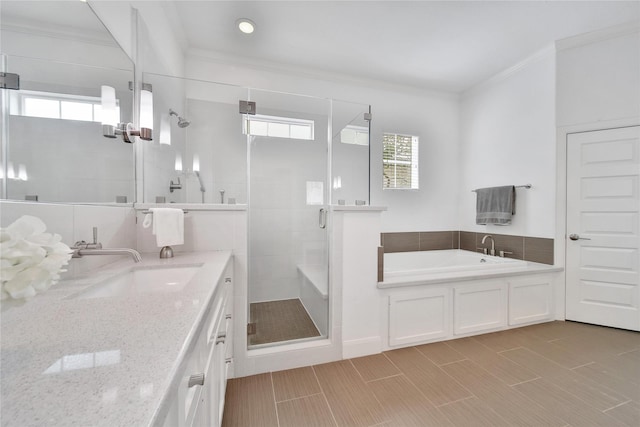 8322 Merlin Dr, Spring Valley Village, TX 77055 - full bathroom featuring ornamental molding, healthy amount of natural light, a stall shower, vanity, and a garden tub