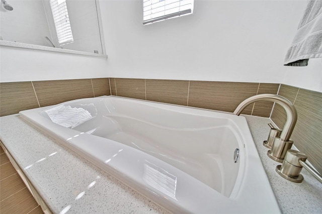 8322 Merlin Dr, Spring Valley Village, TX 77055 - bathroom featuring a garden tub