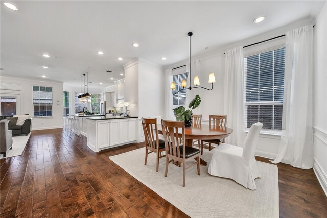 8322 Merlin Dr, Spring Valley Village, TX 77055 - dining room featuring a chandelier, dark wood-style floors, crown molding, baseboards, and recessed lighting