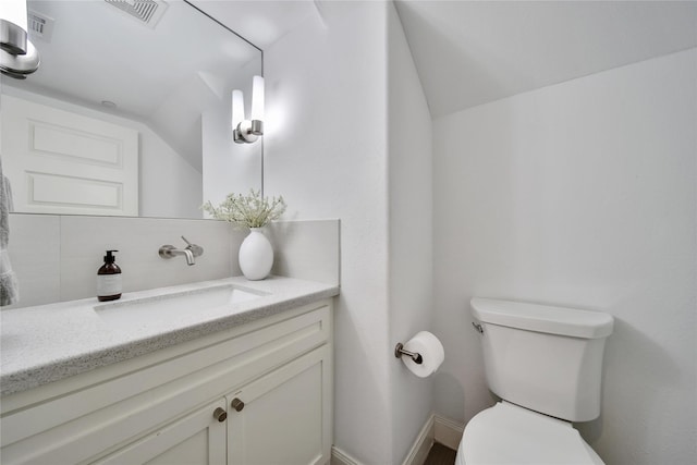 8322 Merlin Dr, Spring Valley Village, TX 77055 - half bath with vaulted ceiling, toilet, vanity, and baseboards