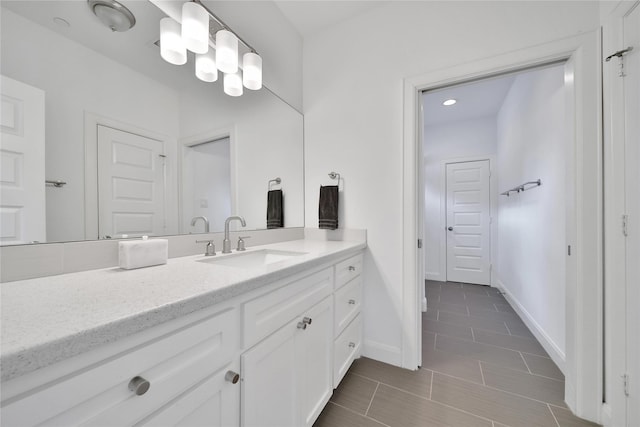 8322 Merlin Dr, Spring Valley Village, TX 77055 - bathroom with vanity, baseboards, and tile patterned flooring