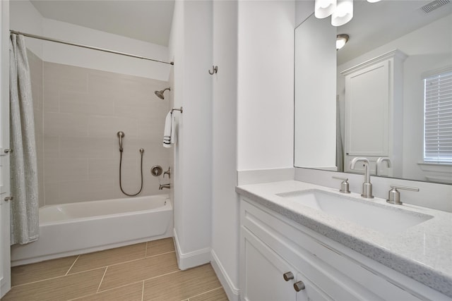 8322 Merlin Dr, Spring Valley Village, TX 77055 - bathroom with shower / tub combo, baseboards, and vanity