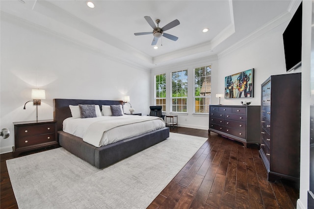 8322 Merlin Dr, Spring Valley Village, TX 77055 - bedroom featuring dark wood finished floors, a tray ceiling, crown molding, baseboards, and recessed lighting