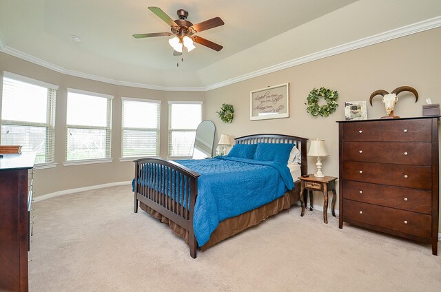 bedroom featuring baseboards, ornamental molding, light carpet, and ceiling fan