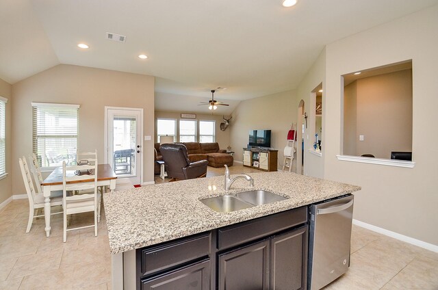 kitchen featuring a sink, a kitchen island with sink, a ceiling fan, light tile patterned floors, and stainless steel dishwasher