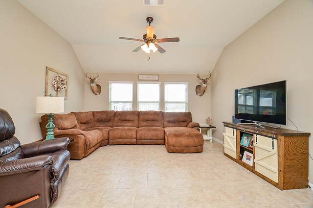 living area with light tile patterned flooring, ceiling fan, vaulted ceiling, and visible vents