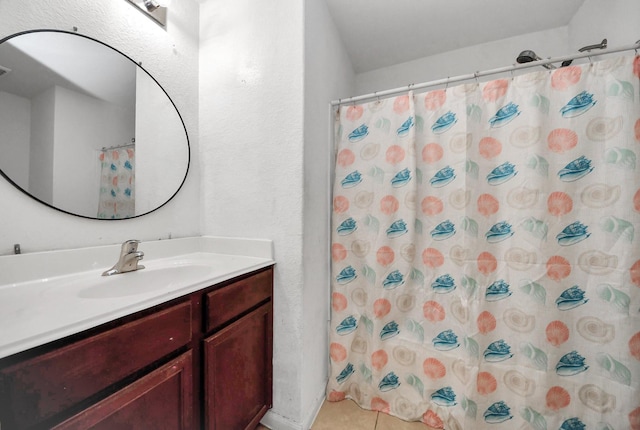 full bath featuring tile patterned floors, curtained shower, and vanity