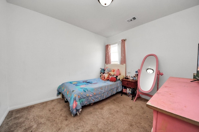 bedroom with carpet floors, baseboards, and visible vents