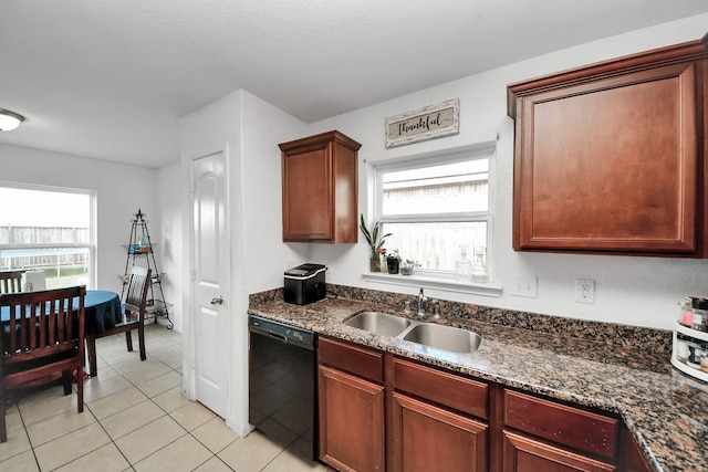 kitchen with a sink, a wealth of natural light, light tile patterned flooring, and dishwasher