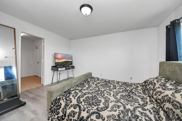 bedroom with wood finished floors