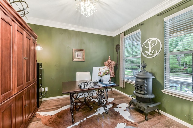 home office featuring a healthy amount of sunlight, baseboards, ornamental molding, and an inviting chandelier