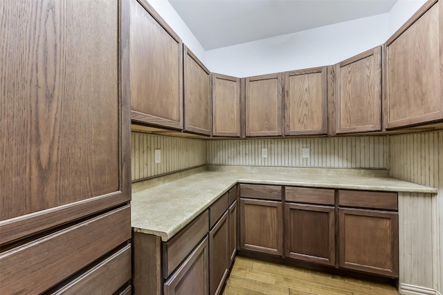 kitchen with light wood-type flooring and light countertops