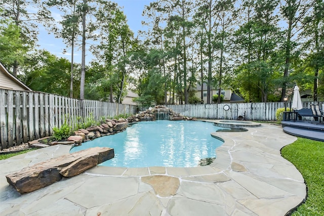view of swimming pool featuring a fenced in pool, a fenced backyard, an in ground hot tub, and a patio area