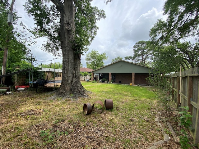 view of yard with fence