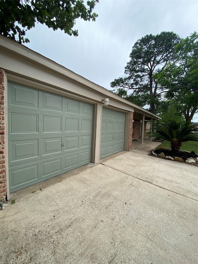 garage featuring driveway