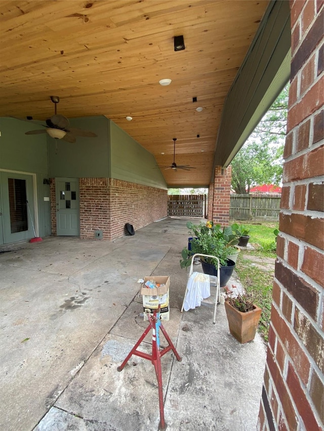 view of patio / terrace with fence and a ceiling fan