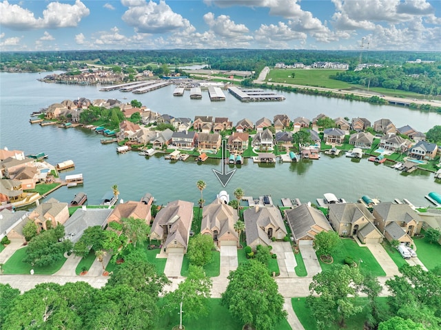 drone / aerial view with a water view and a residential view