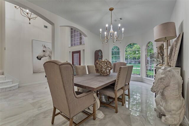 2025 S Shore Blvd, Montgomery, TX 77356 - dining room featuring marble finish floor, arched walkways, a chandelier, and visible vents