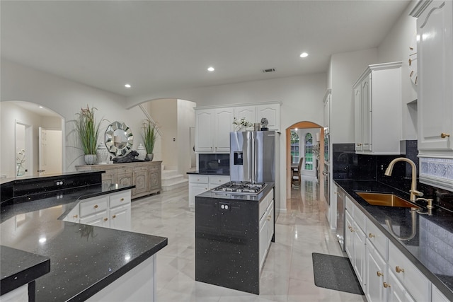 2025 S Shore Blvd, Montgomery, TX 77356 - kitchen featuring recessed lighting, arched walkways, a sink, and appliances with stainless steel finishes