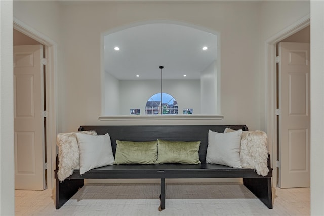 sitting room featuring arched walkways and recessed lighting