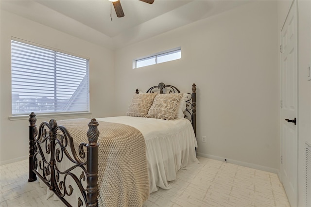 bedroom with a ceiling fan, baseboards, and visible vents