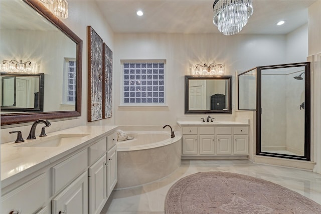 2025 S Shore Blvd, Montgomery, TX 77356 - bathroom with a sink, a shower stall, a garden tub, and a notable chandelier