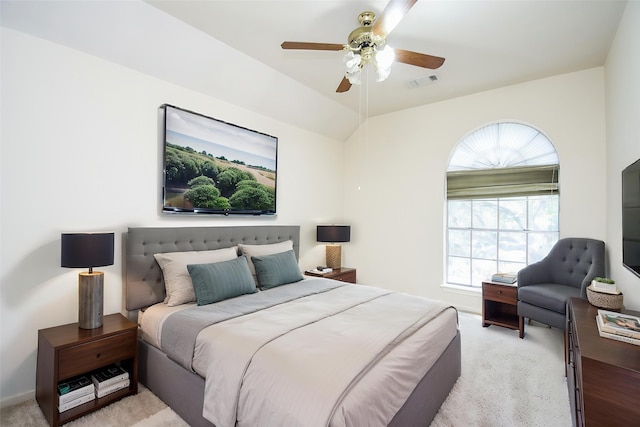 bedroom featuring visible vents, ceiling fan, and light carpet