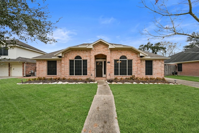 view of front of house with brick siding, a shingled roof, and a front lawn