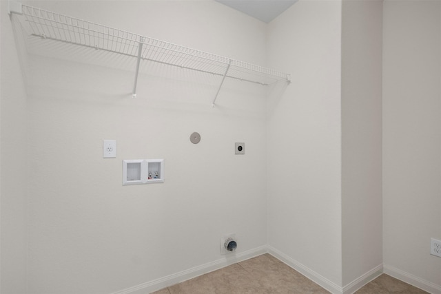 washroom with laundry area, hookup for a washing machine, baseboards, light tile patterned floors, and hookup for an electric dryer