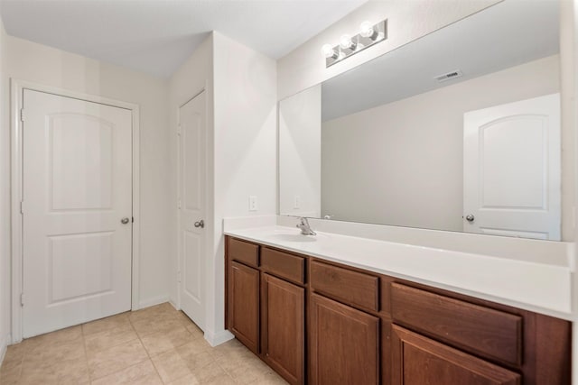 bathroom featuring visible vents, tile patterned floors, and vanity
