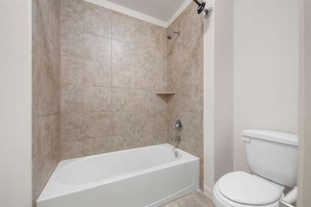 bathroom with tile patterned flooring, washtub / shower combination, and toilet