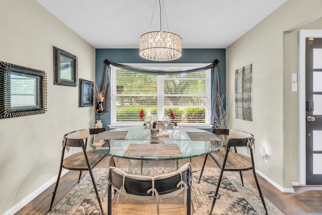 9114 Colony Cove Dr, Spring, TX 77379 - dining area featuring baseboards, a chandelier, a wealth of natural light, and wood finished floors