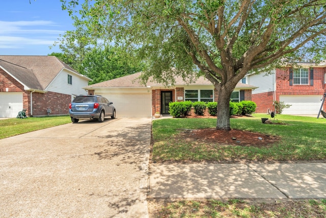 9114 Colony Cove Dr, Spring, TX 77379 - traditional home with a garage, concrete driveway, a front yard, and brick siding