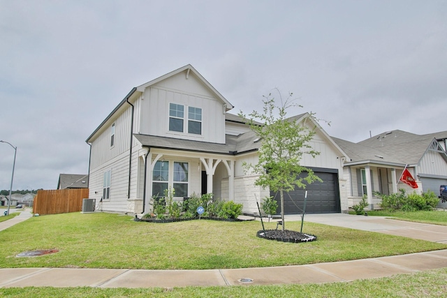 traditional-style home with fence, an attached garage, board and batten siding, concrete driveway, and central air condition unit