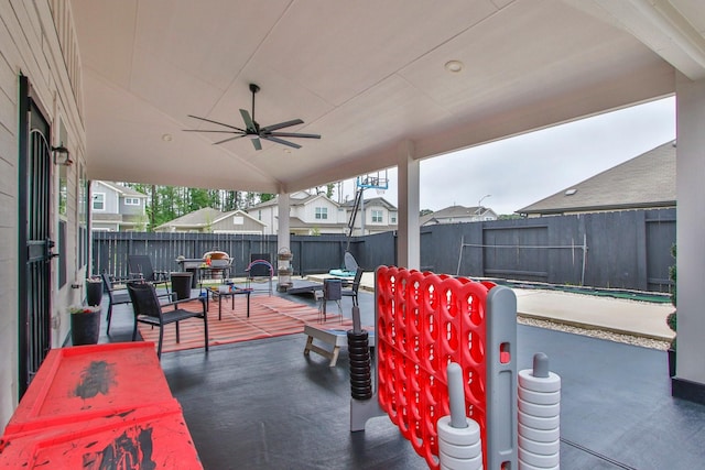 view of patio featuring a fenced backyard and a ceiling fan