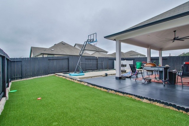 view of patio with a fenced backyard and ceiling fan