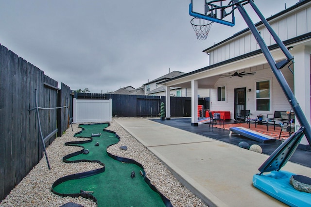 view of patio / terrace with a fenced backyard and ceiling fan