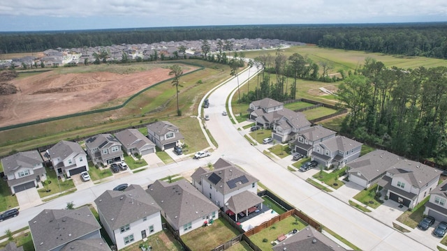bird's eye view featuring a residential view and a view of trees