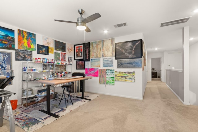 office space with baseboards, carpet, a ceiling fan, and visible vents