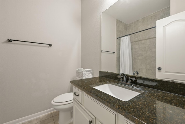 bathroom featuring tile patterned floors, baseboards, vanity, toilet, and a shower with shower curtain