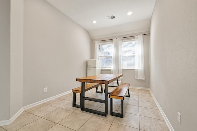 dining room featuring visible vents, light tile patterned flooring, baseboards, recessed lighting, and vaulted ceiling